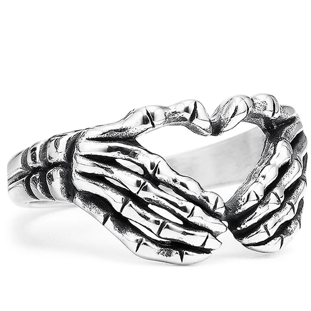 Förlovningsring som visar två skeletthänder som formar ett hjärta