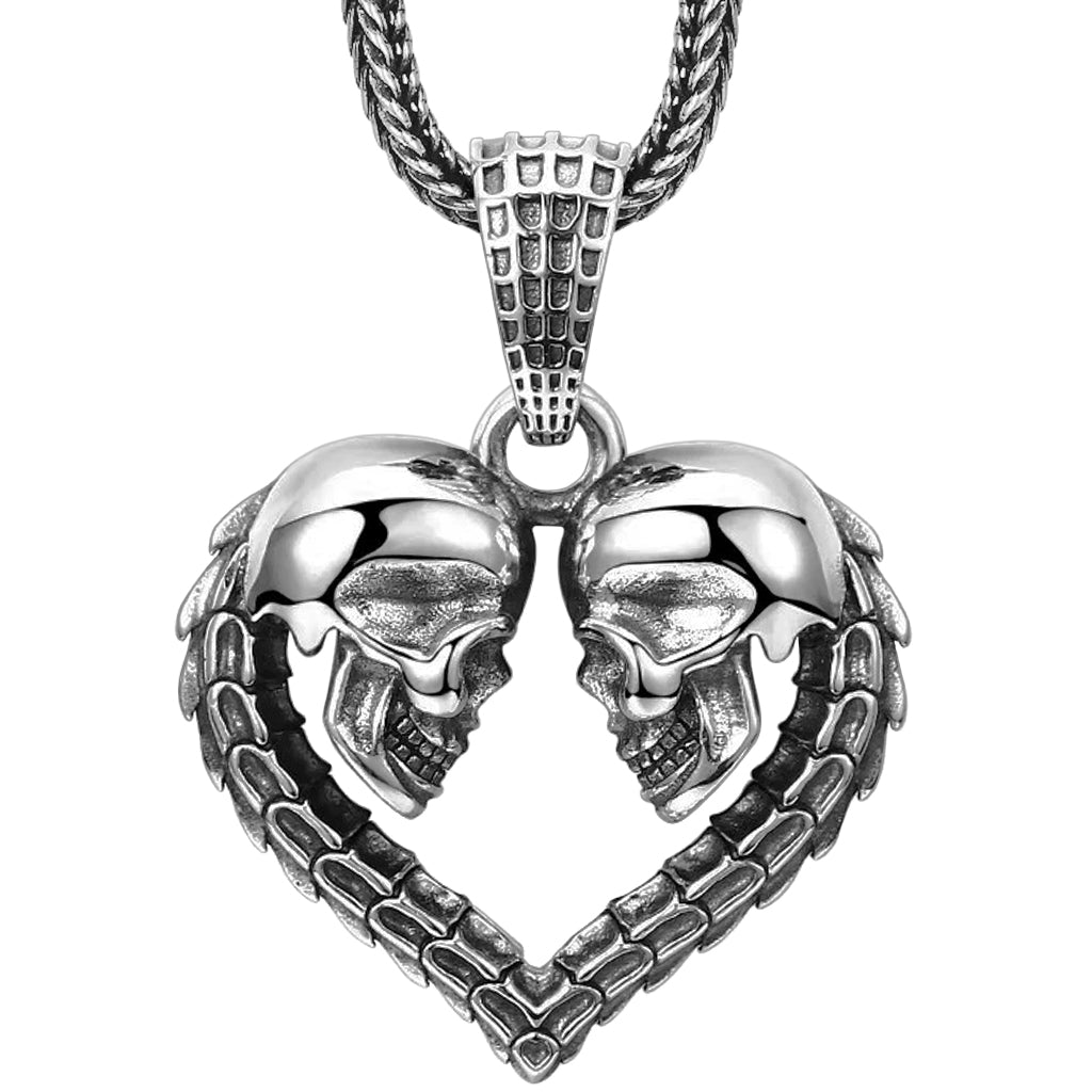 Silverfärgat sterlingsilver halsband föreställande ett hjärta med två dödskallar