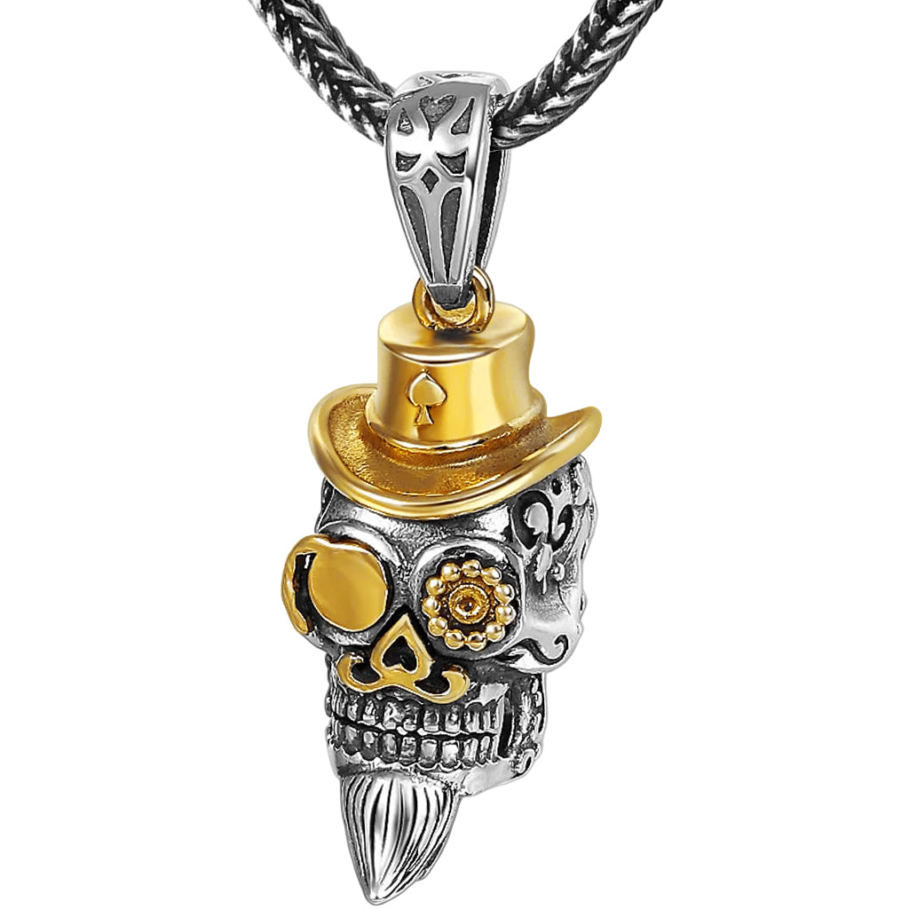 Silverfärgat hänge föreställande en dödskalle med guldfärgad hatt, mustasch och monokel