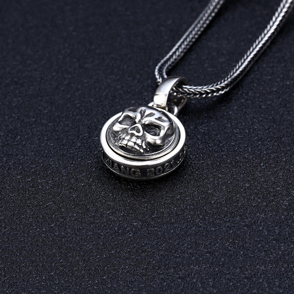Runt silver halsband med roterande dödskalle
