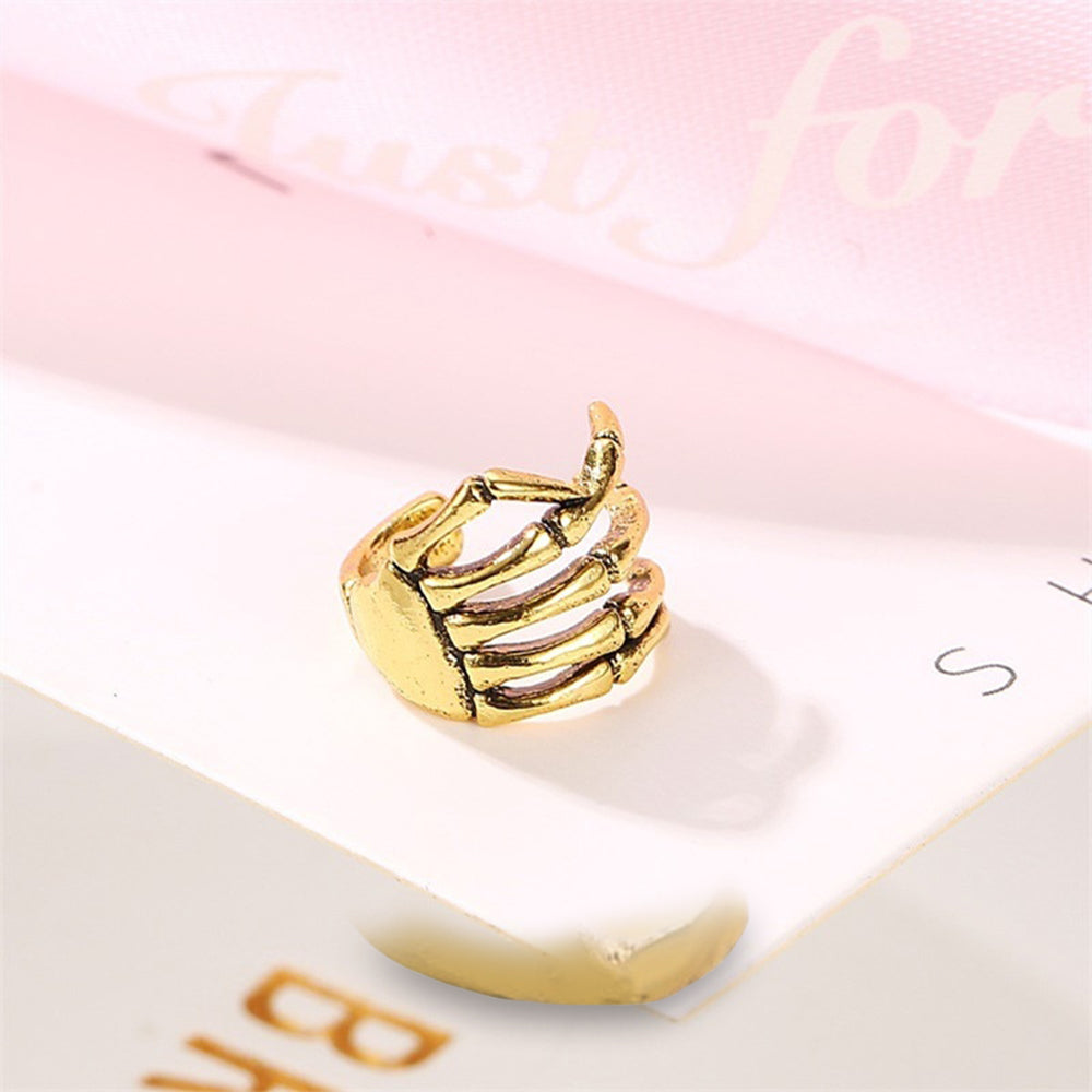 Ear Cuff Skeletthand (Guldstål)