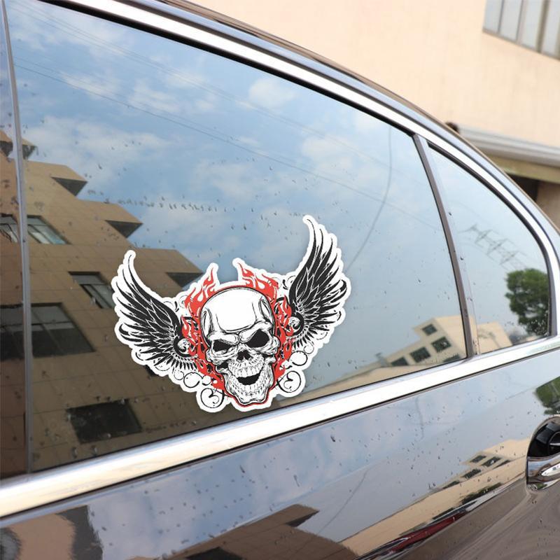 Klistermärke Dödskalle Änglavingar