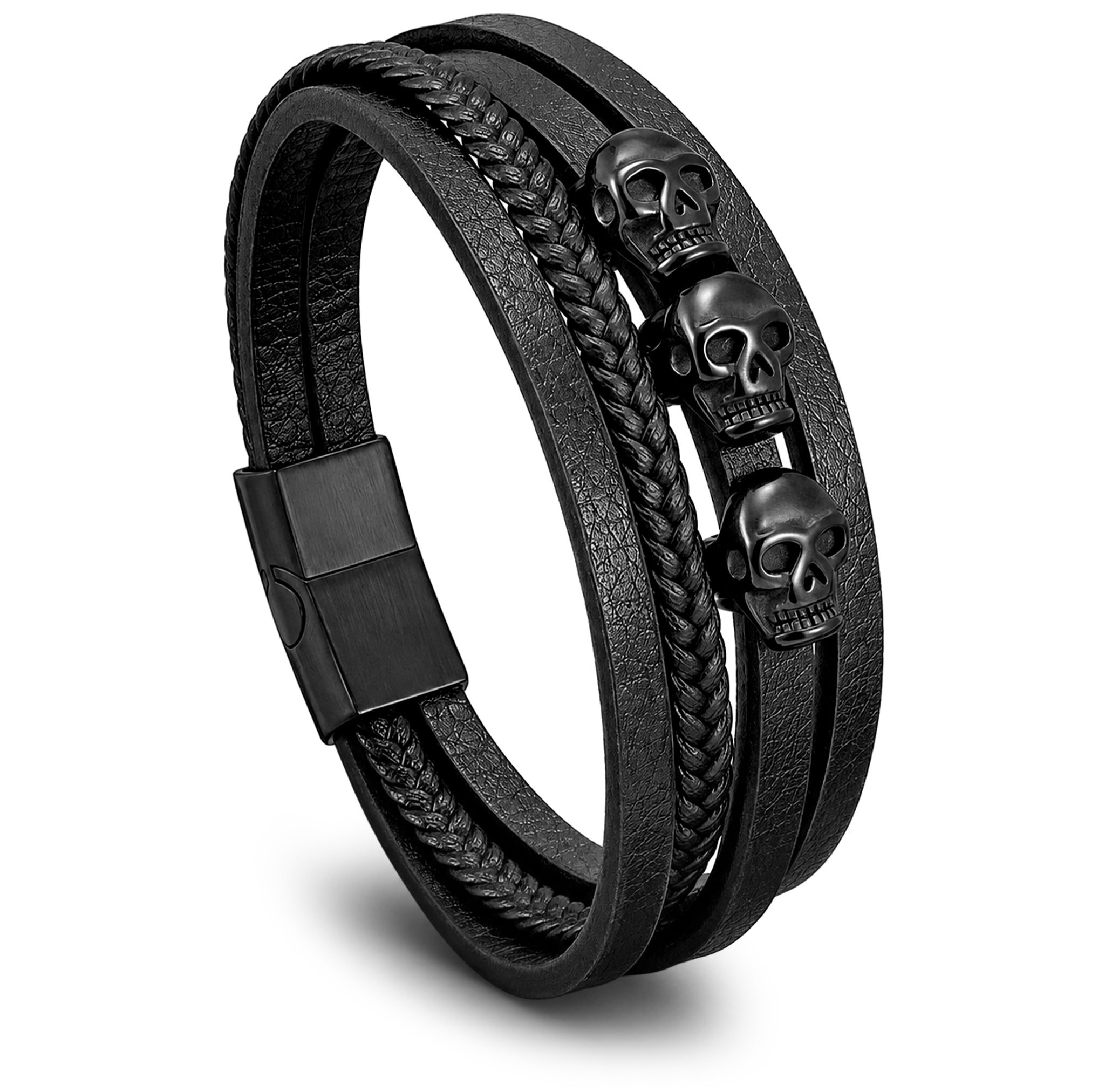 Svart lager-på-lager läderarmband med tre dödskallar av rostfritt stål