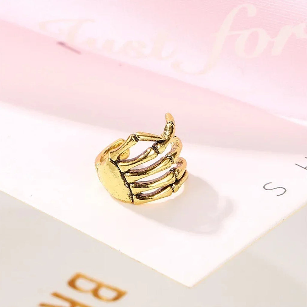 Ear Cuff Skeletthand (Guldstål)